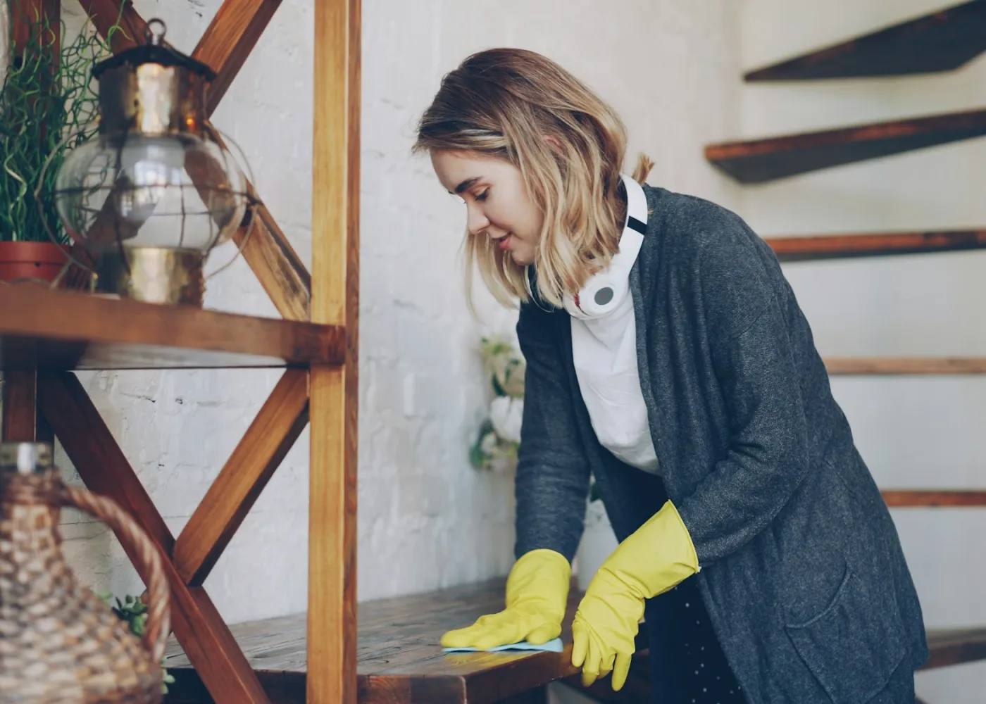 A cleaner tidying a kitchen